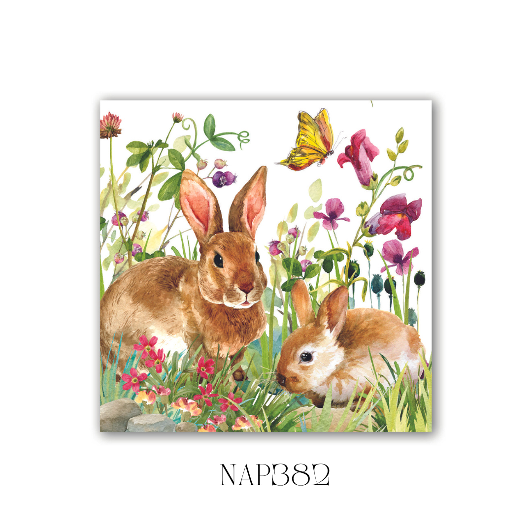 Pack of 20 Bunny Meadow Cocktail Napkins with a charming bunny and floral design. These soft, triple-ply paper napkins add elegance to special occasions or everyday gatherings. Pack size: 6, folded dimensions: 12.5 x 12.5 cm