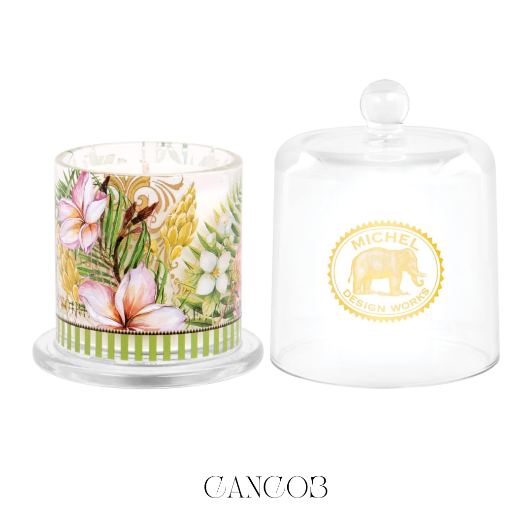 Island Breeze Cloche Candle, featuring a bell-shaped glass cloche that elegantly covers the soy blend candle. Lifting the cloche releases a refreshing aroma of tropical scents, enhancing any space with its strong fragrance throw and vibrant design