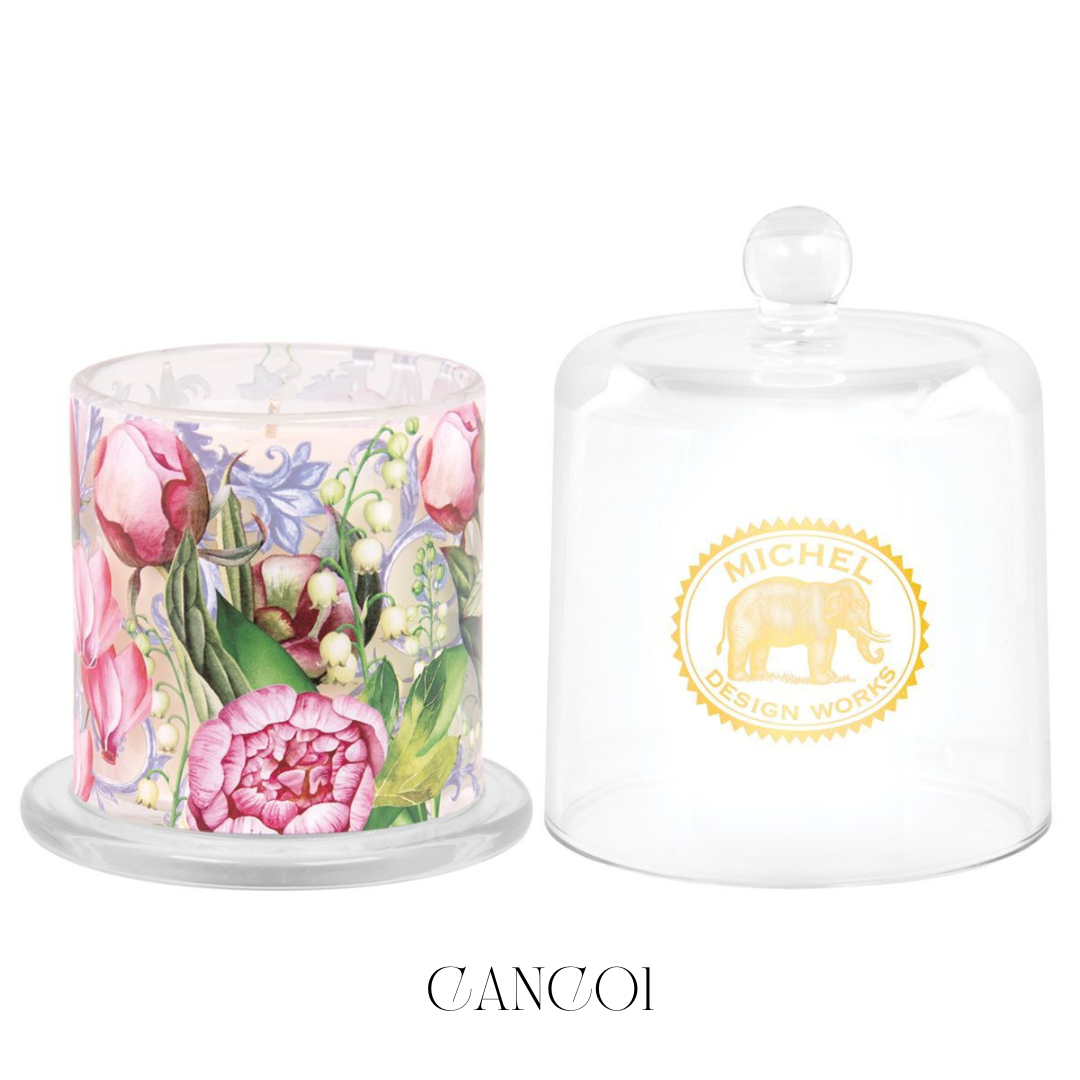 Porcelain Peony Cloche Candle, encapsulated under a bell-shaped glass cloche. Lifting the cloche releases a sophisticated floral fragrance with notes of peony, jasmine, lily of the valley, enhanced by musk and sandalwood, creating a serene and elegant atmosphere