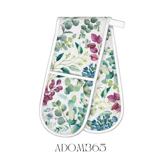 Eucalyptus and Mint Double Oven Mitt displayed flat, crafted from 100% cotton with a cotton/poly fill for extra thickness. The mitt measures approximately 85 x 27.75 cm, adorned with a refreshing eucalyptus and mint design, providing effective protection from hot kitchen dishes