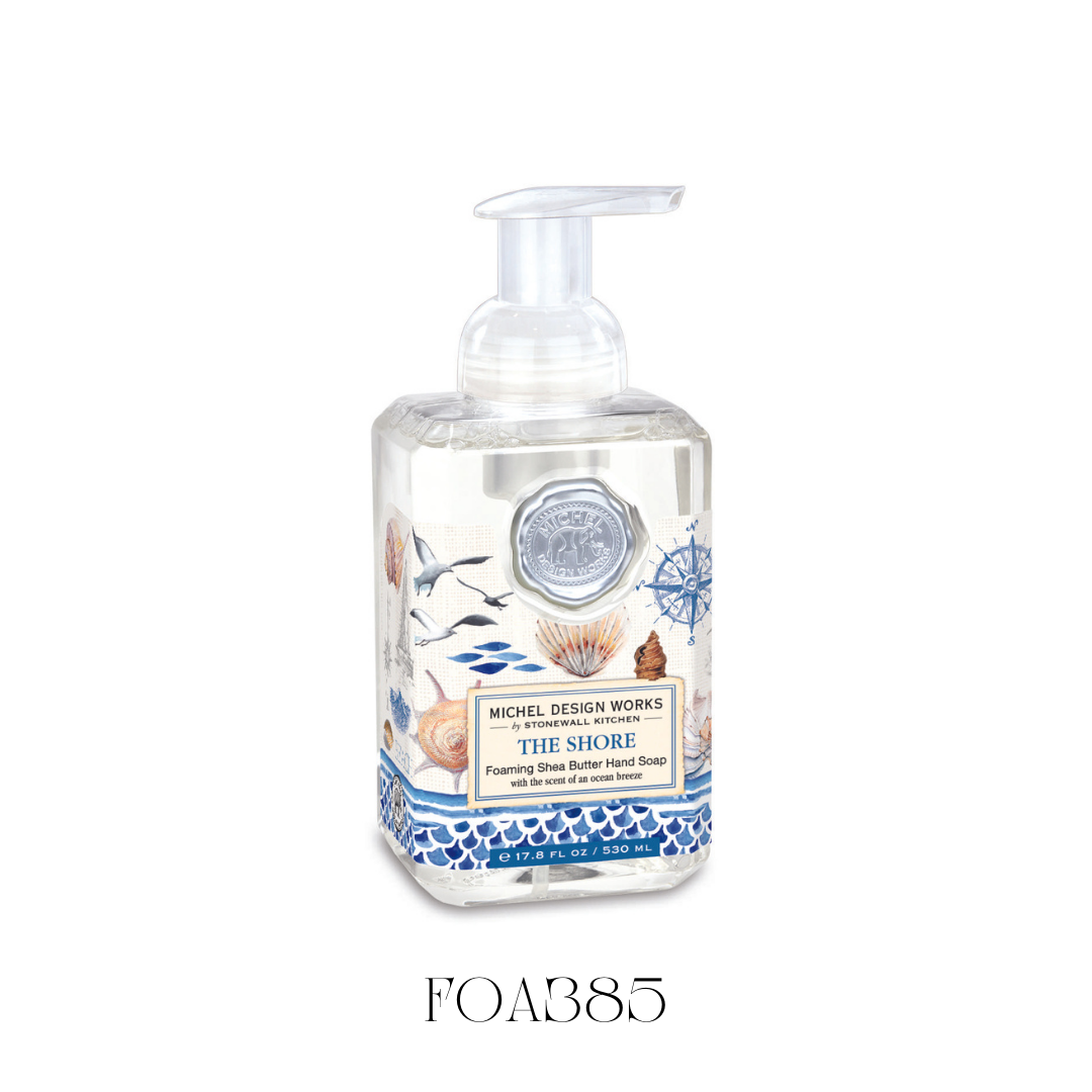 Foaming Soap The Shore in a generously sized bottle, featuring classic coastal imagery in shades of ocean blue. This hand soap is enriched with shea butter and aloe vera for gentle cleansing and moisturizing, capturing the evocative scents of a day at the beach