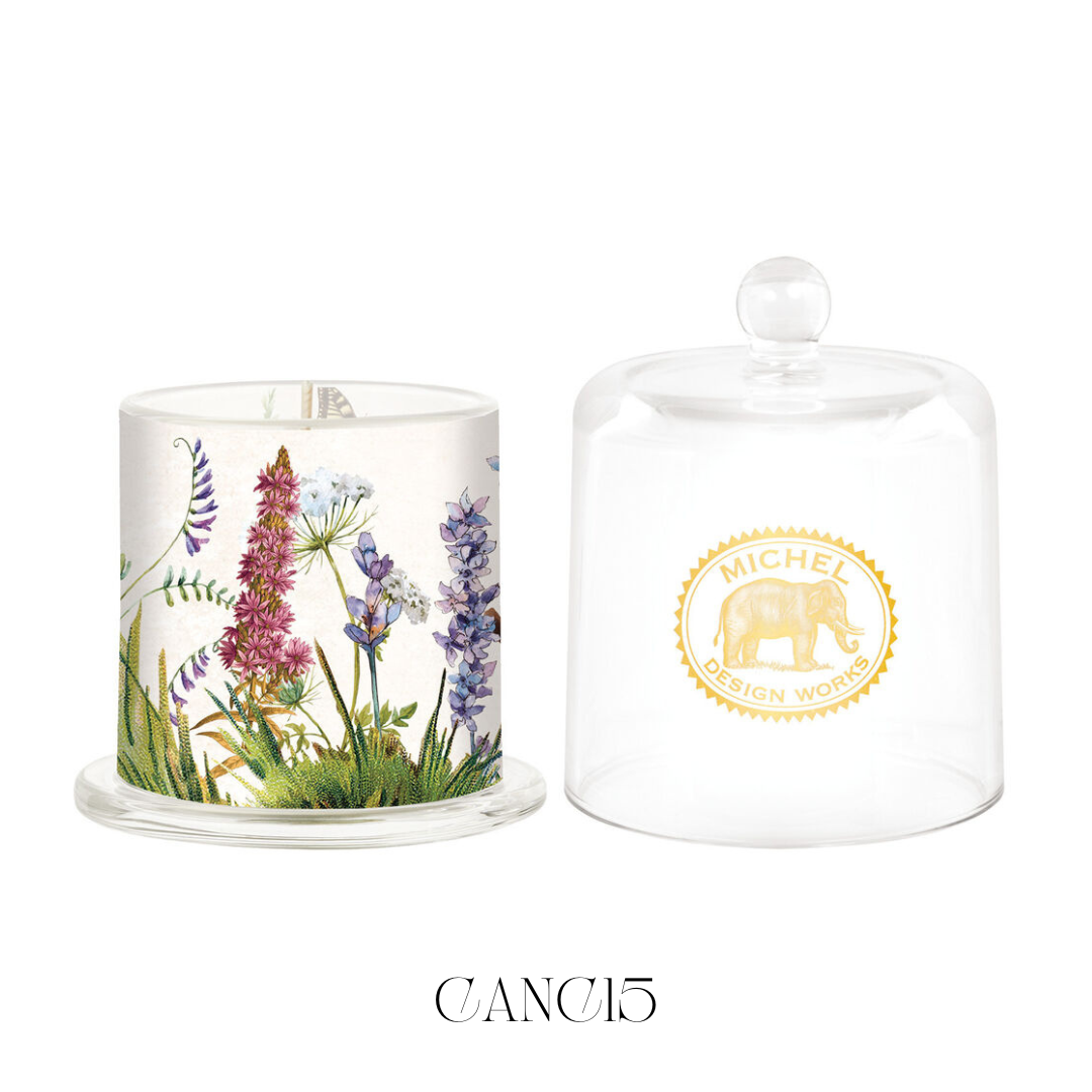 Garden Path Cloche Candle in a bell-shaped glass cloche, ready to release a fresh garden scent when lifted. This soy blend candle offers a strong fragrance throw, perfect for filling any room with the delightful aroma of a garden in full bloom