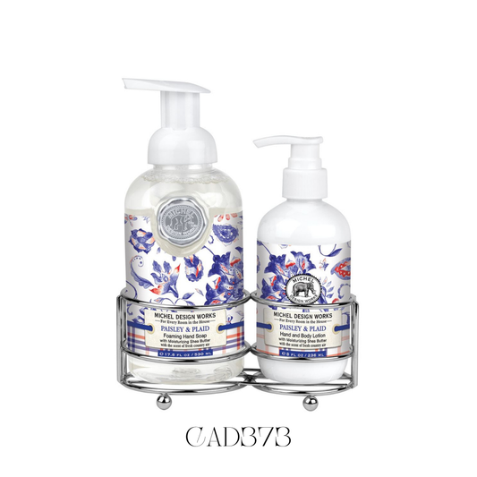 Hand Care Caddy Paisley and Plaid featuring a foaming hand soap and a rich hand and body lotion, both in a fashion-forward design combining paisley with red, white, and blue plaid. Set in a stylish silver-toned caddy, perfect for adding a classic yet modern touch to bathroom or kitchen décor