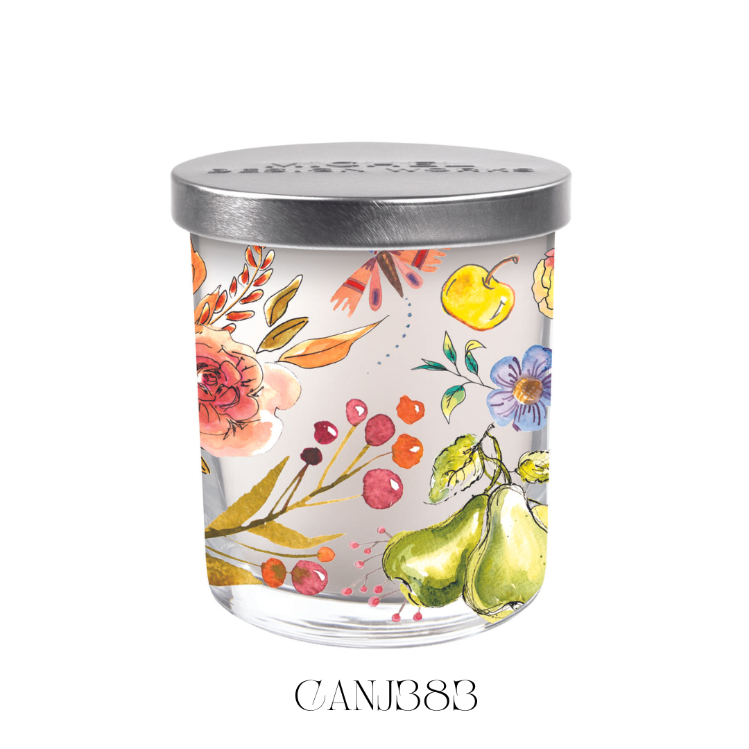 Jubilee Candle Jar with Lid, featuring a soy blend wax and detailed artwork applied directly to the glass. The candle has a burn time of over 30 hours and offers a fragrance blend of dewy florals, musky amber, and raspberry highlights. Approximate size: 8.3 x 8.3 x 11.5 cm