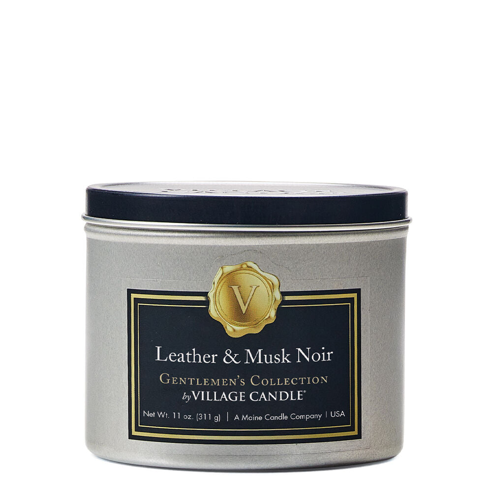 Leather and Musk Noir Stonewall Gentlemen’s Candle in a sleek glass container, crafted with food-grade paraffin wax for a clean, even burn. The candle offers a sophisticated fragrance blend of Amalfi lemon, bergamot, white thyme, mineral water, driftwood, sheer leather, and musk. Perfect for adding a refined scent to any space