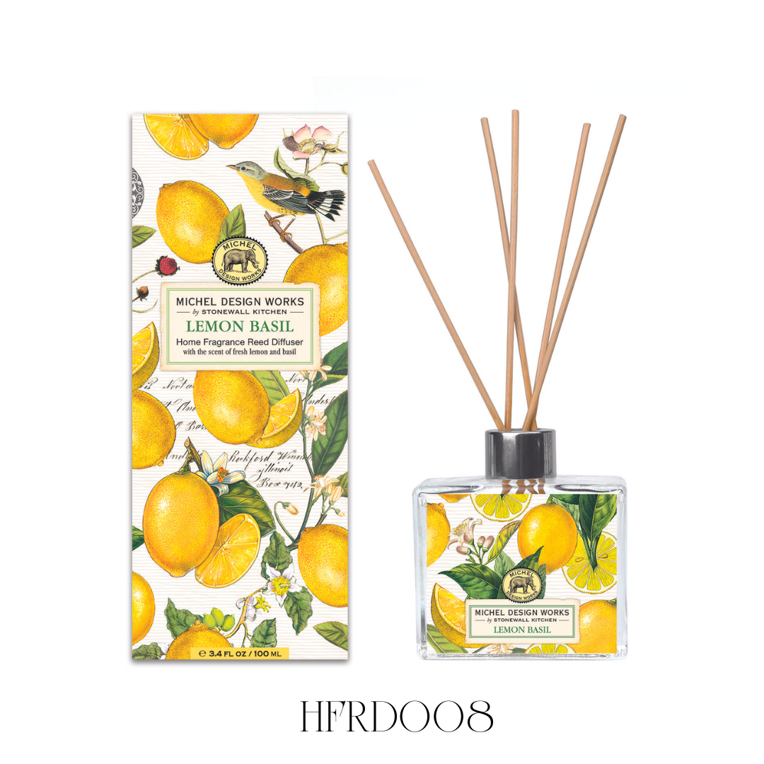 Lemon Basil Reed Diffuser set featuring an elegant glass decanter with beautifully printed artwork. This diffuser includes eight reeds and is designed to fill any kitchen or bathroom with a fresh fragrance of citrus notes, including lemon and mandarin, enhanced with green basil leaf. Contains 100 ml of fragrance oil