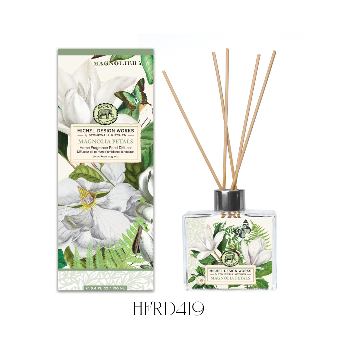 Magnolia Petals Reed Diffuser set featuring an elegant glass decanter with beautifully detailed artwork of verdant greens and bright white petals. This diffuser provides a luxurious fragrance throw with floral and citrus notes, perfect for adding a refreshing scent to any room. Includes eight reeds and 100 ml of fragrance oil