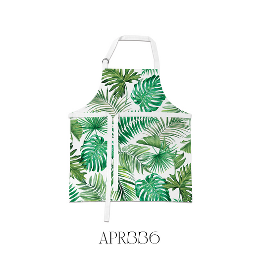 Model wearing the Palm Breeze Chef’s Apron, showcasing its adjustable neck with metal D-rings for a tailored fit. Made from high-quality 100% cotton, this apron adds a touch of tropical flair and practicality to any kitchen