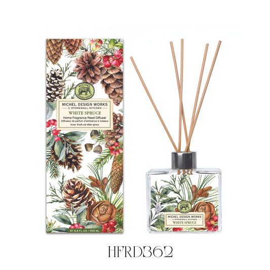 White Spruce Reed Diffuser set featuring an elegant glass decanter with beautifully printed artwork. This diffuser includes eight reeds and is designed to fill any space with the woody scent of pine needles, true spruce, and subtle hints of fruit and spice. Contains 100 ml of fragrance oil, perfect for enhancing kitchens, bathrooms, or any room needing a refreshing aroma